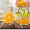 Manual Lemon Squeezer with Built-in Measuring Cup